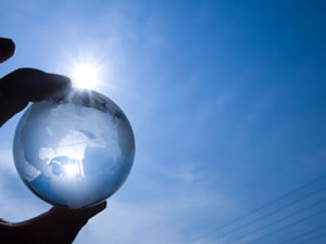 Photo of glass globe against sunny sky